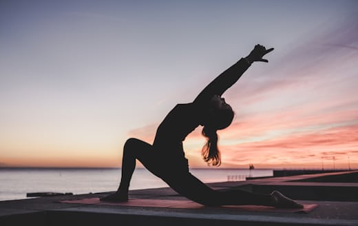 Woman stretching on a mat